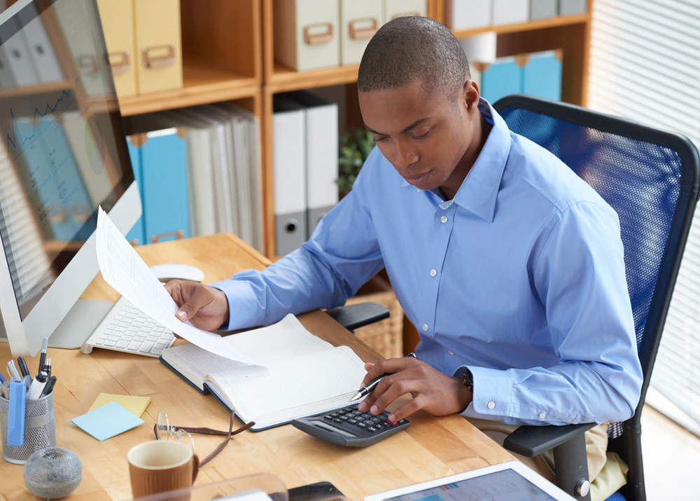 High angle view male accountant checking financial document Ethics High angle view male accountant checking financial document Ethics